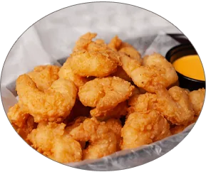 Popcorn Shrimp — Crunchy, breaded shrimp fried until golden.